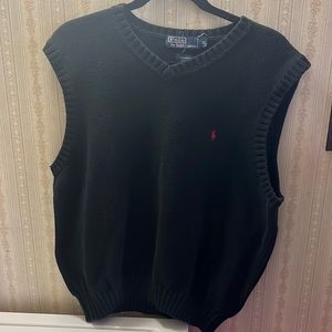 A black sweater vest good for cold climates while keeping an above-casual look.
